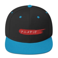 Load image into Gallery viewer, Black and Teal snapback hat with Animeted Brand's red paintbrush logo written in Japanese Katakana.