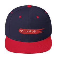 Load image into Gallery viewer, Navy and Red snapback hat with Animeted Brand's red paintbrush logo written in Japanese Katakana.