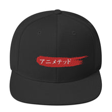 Load image into Gallery viewer, Black snapback hat with Animeted Brand's red paintbrush logo written in Japanese Katakana.