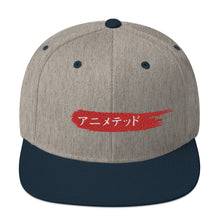 Load image into Gallery viewer, Heather Gray and Navy snapback hat with Animeted Brand's red paintbrush logo written in Japanese Katakana.