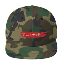 Load image into Gallery viewer, Camouflage style snapback hat with Animeted Brand's red paintbrush logo written in Japanese Katakana.