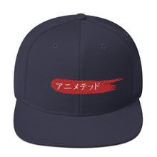 Load image into Gallery viewer, Navy snapback hat with Animeted Brand's red paintbrush logo written in Japanese Katakana.
